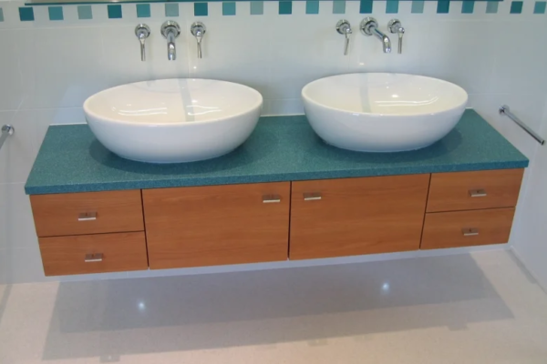 Roktops Worksurfaces LTD | Bathrooms | Granite Worktops | Granite bathroom worktop with wooden cupboards underneath
